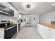 Well-lit kitchen featuring modern appliances, white cabinetry, and a butcher block countertop at 1501 Delaware Ave, St Cloud, FL 34769