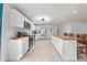 Bright kitchen featuring white cabinets, stainless steel appliances, tile floor, and a spacious island with butcher block top at 1501 Delaware Ave, St Cloud, FL 34769