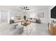 Spacious living area with modern decor, tile flooring, and ample natural light at 1501 Delaware Ave, St Cloud, FL 34769