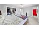 Spacious main bedroom featuring a walk in closet and tile floor at 1501 Delaware Ave, St Cloud, FL 34769