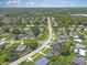 A scenic aerial shot of a neighborhood street surrounded by lush green trees and vegetation at 2806 Bonneville Dr, Orlando, FL 32826