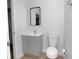 Bathroom featuring updated vanity, new toilet, new flooring and white trim at 2806 Bonneville Dr, Orlando, FL 32826