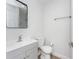 Bright bathroom featuring updated vanity, new toilet and light gray walls at 2806 Bonneville Dr, Orlando, FL 32826