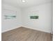 Bedroom featuring hardwood floors, and bright lighting from two windows at 2806 Bonneville Dr, Orlando, FL 32826