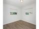 Bedroom featuring hardwood floors, and bright lighting from two windows at 2806 Bonneville Dr, Orlando, FL 32826