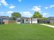 Inviting single-story home featuring a well-manicured lawn and convenient carport at 2806 Bonneville Dr, Orlando, FL 32826