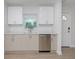 Modern kitchen featuring white cabinets, stainless steel dishwasher, and sleek countertops by the door at 2806 Bonneville Dr, Orlando, FL 32826
