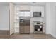 Bright kitchen features stainless steel appliances, sleek cabinets, and wood-look flooring at 2806 Bonneville Dr, Orlando, FL 32826