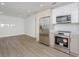 Bright kitchen features stainless steel appliances, sleek cabinets, and wood-look flooring at 2806 Bonneville Dr, Orlando, FL 32826