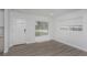 Bright living room features modern wood floors, neutral paint, and lots of natural light at 2806 Bonneville Dr, Orlando, FL 32826