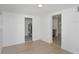Room features wood-look flooring, beadboard paneling and doorways to other areas of the house at 2806 Bonneville Dr, Orlando, FL 32826