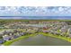 Aerial view showcasing the property's position within a lakeside community near a lake at 2823 Sail Breeze Way, Kissimmee, FL 34744