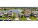 Beautiful lakefront home features a manicured lawn, lush landscaping and a brick driveway in an attractive community at 2823 Sail Breeze Way, Kissimmee, FL 34744