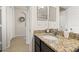 Bathroom features a granite countertop with sink and tile floors at 2823 Sail Breeze Way, Kissimmee, FL 34744