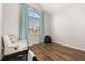 Bedroom features wood floor, high ceilings, and a large window providing natural light at 2823 Sail Breeze Way, Kissimmee, FL 34744