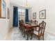 Formal dining room with a large window and blue accents at 2823 Sail Breeze Way, Kissimmee, FL 34744