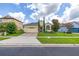Charming home features manicured lawn, lush landscaping and a brick driveway in an attractive residential neighborhood at 2823 Sail Breeze Way, Kissimmee, FL 34744