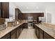 Eat-in kitchen with stainless steel appliances and granite countertops at 2823 Sail Breeze Way, Kissimmee, FL 34744
