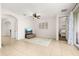 Cozy living room with neutral tones, an area rug, and sliding glass door at 2823 Sail Breeze Way, Kissimmee, FL 34744