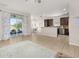 Open concept layout featuring a living room, dining area, and kitchen at 2823 Sail Breeze Way, Kissimmee, FL 34744