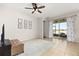 Living room overlooking the water with access to an outdoor seating area at 2823 Sail Breeze Way, Kissimmee, FL 34744