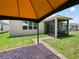 View of backyard, showing a screened patio, gazebo and ample outdoor space and greenery at 2829 Shelburne Way, St Cloud, FL 34772