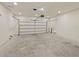 A large garage with white walls and a concrete floor at 2829 Shelburne Way, St Cloud, FL 34772