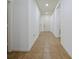 Inviting hallway featuring neutral tile flooring and access to other rooms in the home at 2829 Shelburne Way, St Cloud, FL 34772