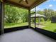 Screened patio overlooking a gazebo in a backyard with lush greenery and ample space at 2829 Shelburne Way, St Cloud, FL 34772