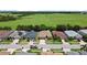 Aerial view of a quiet suburban neighborhood with green spaces in the background at 2829 Shelburne Way, St Cloud, FL 34772