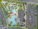 Aerial view of the community pool area, showcasing lazy river, pool, and ample parking at 4403 Scene Ln, Kissimmee, FL 34746