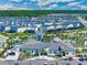 Aerial view of community clubhouse, pools, and nearby homes at 4403 Scene Ln, Kissimmee, FL 34746