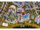 Aerial view showcasing a community pool with lazy river, mini golf, and other water features at 4403 Scene Ln, Kissimmee, FL 34746