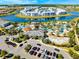 Offers an aerial view of community amenities including pools, splashpad, and clubhouse overlooking a scenic lake at 4403 Scene Ln, Kissimmee, FL 34746