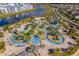 Aerial view of community with lazy river, mini golf, slides, and other water features at 4403 Scene Ln, Kissimmee, FL 34746