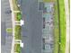 Overhead view of townhomes showcasing private screened-in pools and dedicated parking areas at 4403 Scene Ln, Kissimmee, FL 34746