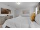 Well-lit bedroom featuring a king bed, side table, and a mounted TV for entertainment at 4403 Scene Ln, Kissimmee, FL 34746