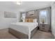 Comfortable bedroom with a king bed, neutral tones, and natural light from two windows at 4403 Scene Ln, Kissimmee, FL 34746
