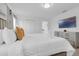 Bright bedroom with a king bed, TV, dresser, and a spacious closet for ample storage at 4403 Scene Ln, Kissimmee, FL 34746