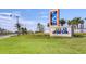 Community sign amidst lush landscaping at 4403 Scene Ln, Kissimmee, FL 34746