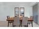 Stylish dining area featuring modern furniture, elegant decor, and seamless flow into the adjacent living spaces at 4403 Scene Ln, Kissimmee, FL 34746
