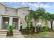 Stylish townhome featuring a modern facade, well-maintained landscaping, and welcoming entryway at 4403 Scene Ln, Kissimmee, FL 34746