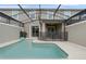 Relaxing private pool area with a safety fence and a patio area with dining set at 4403 Scene Ln, Kissimmee, FL 34746