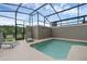 Sparkling screened-in pool surrounded by lounge chairs, offering a relaxing outdoor experience at 4403 Scene Ln, Kissimmee, FL 34746