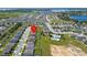 Aerial view of a residential area showing a home with nearby community pool and surrounding suburban landscape at 454 Sunfish Dr, Winter Haven, FL 33881