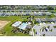 Aerial view showcasing a community pool, parking, and homes in a well-maintained neighborhood at 454 Sunfish Dr, Winter Haven, FL 33881