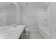 This bathroom offers marble countertops, tile floors, and bathtub with shower combo at 454 Sunfish Dr, Winter Haven, FL 33881