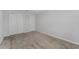 Empty bedroom featuring carpeted floors, a window, and double door closet at 454 Sunfish Dr, Winter Haven, FL 33881
