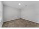 Neutral bedroom features carpet and a window to allow natural light to fill the room at 454 Sunfish Dr, Winter Haven, FL 33881