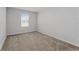 Bedroom with carpeted floors, a window for natural light, and electrical outlets at 454 Sunfish Dr, Winter Haven, FL 33881